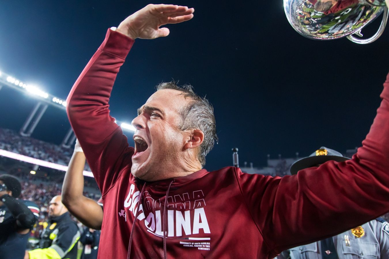 South Carolina Gamecocks head coach Shane Beamer celebrates beating the Missouri Tigers at Williams-Brice Stadium. He is holding the Mayors Cup, given to the winner of the South Carolina-Missouri game.
