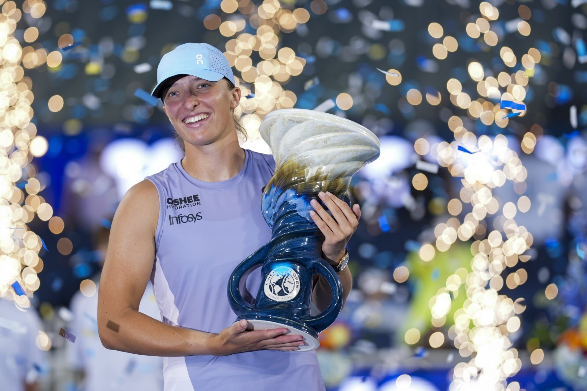 Cincinnati, OH, USA;  Iga Swiatek (POL) poses for a photo with the Rookwood Cup after defeating Jasmine Paolini (ITA) during the Cincinnati Open at the Lindner Family Tennis Center.