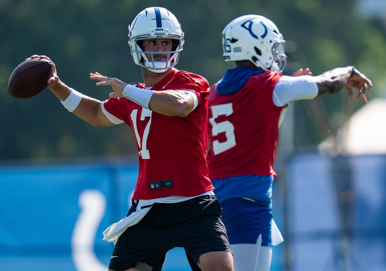 Indianapolis Colts quarterbacks Anthony Richardson Sr. (5) and Daniel Jones (17) pass Wednesday, July 23, 2025, during the first day of training camp held at Grand Park in Westfield.