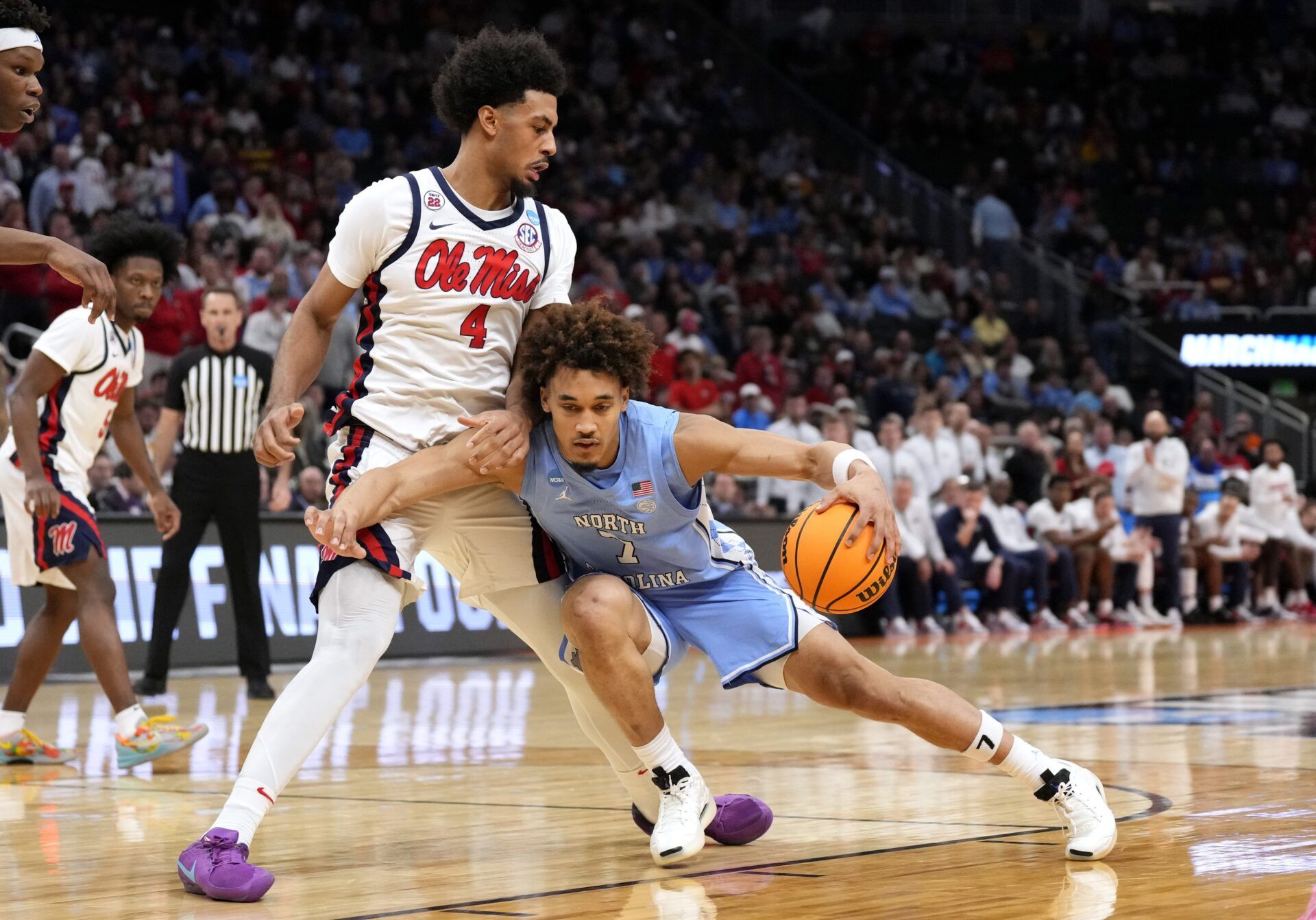 North Carolina Tar Heels guard Seth Trimble (7) drives against Mississippi Rebels forward Jaemyn Brakefield (4) during the second half of a first round NCAA men’s tournament game at Fiserv Forum.