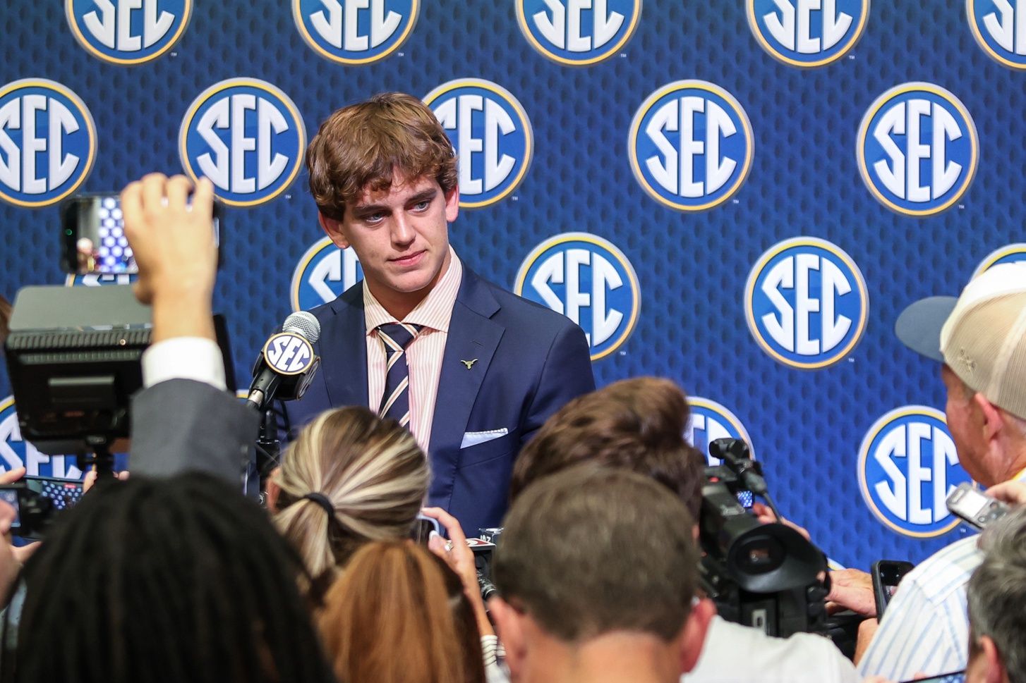 Texas Longhorns quarterback Arch Manning answers questions from the media during SEC Media Days at Omni Atlanta Hotel.