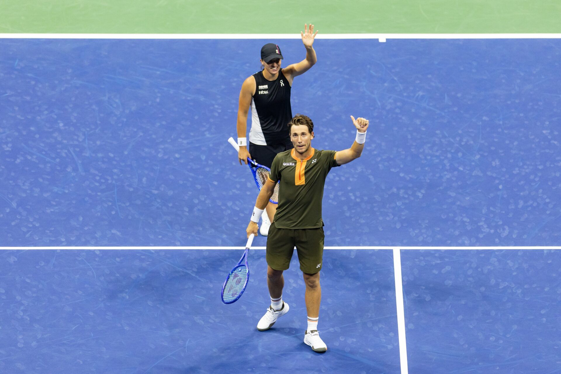 Iga Swiatek of Poland and Casper Ruud of Norway in action against Jack Draper of Great Britain and Jessica Pegula of the United States in the semi-finals of the mixed doubles tournament at the US Open at Arthur Ashe Stadium.