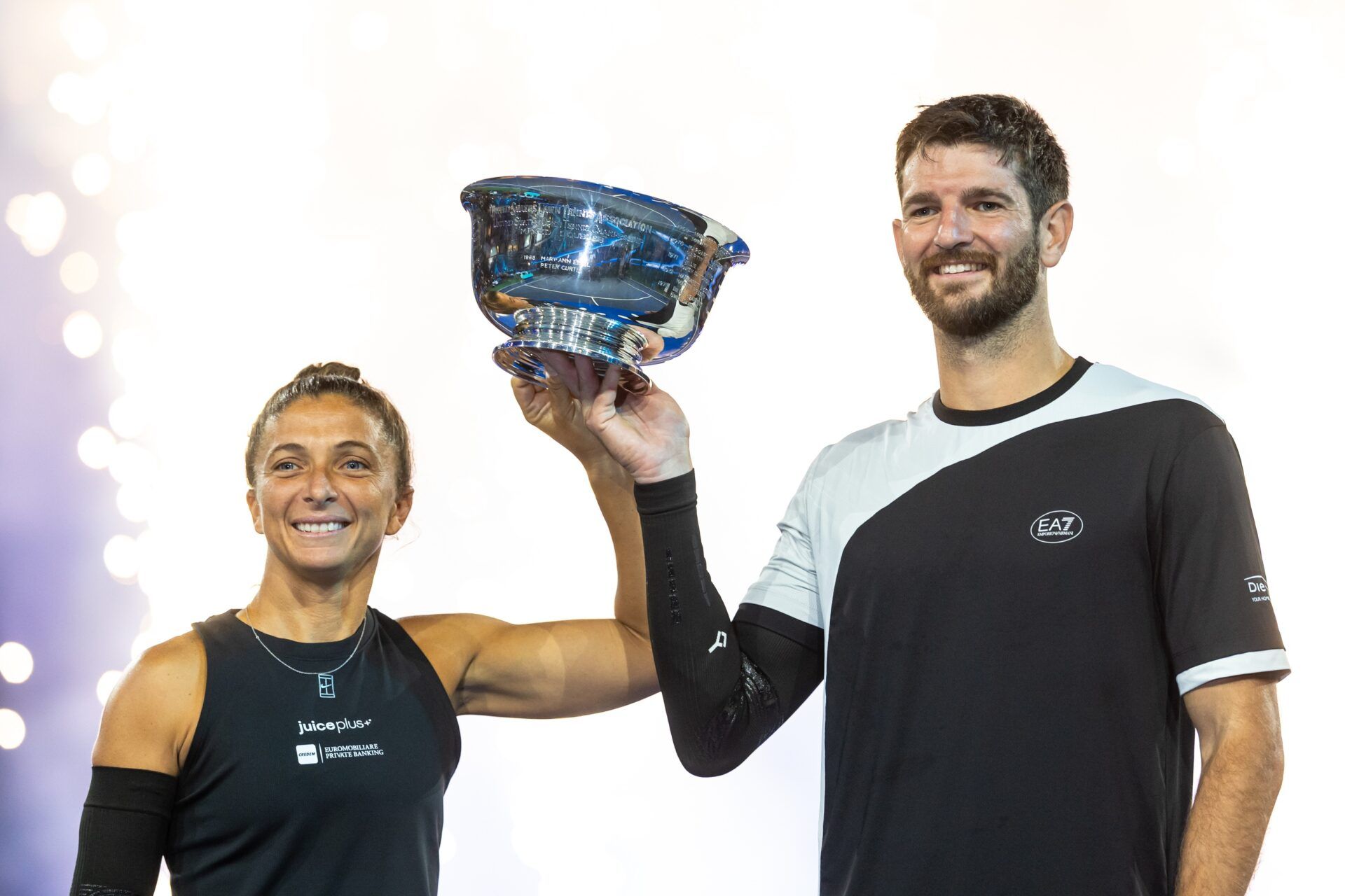 Sara Errani of Italy and Andrea Vavassori of Italy pose with the winner’s trophy after their victory over Casper Ruud of Norway and Ina Swiatek of Poland who pose with the runner up’s trophy after the final of the mixed doubles tournament at the US Open at Arthur Ashe Stadium.
