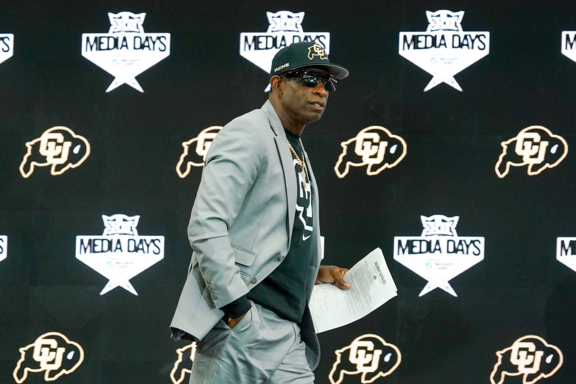 Colorado head coach Deion Sanders walks onto the stage during 2025 Big 12 Football Media Days at The Star.