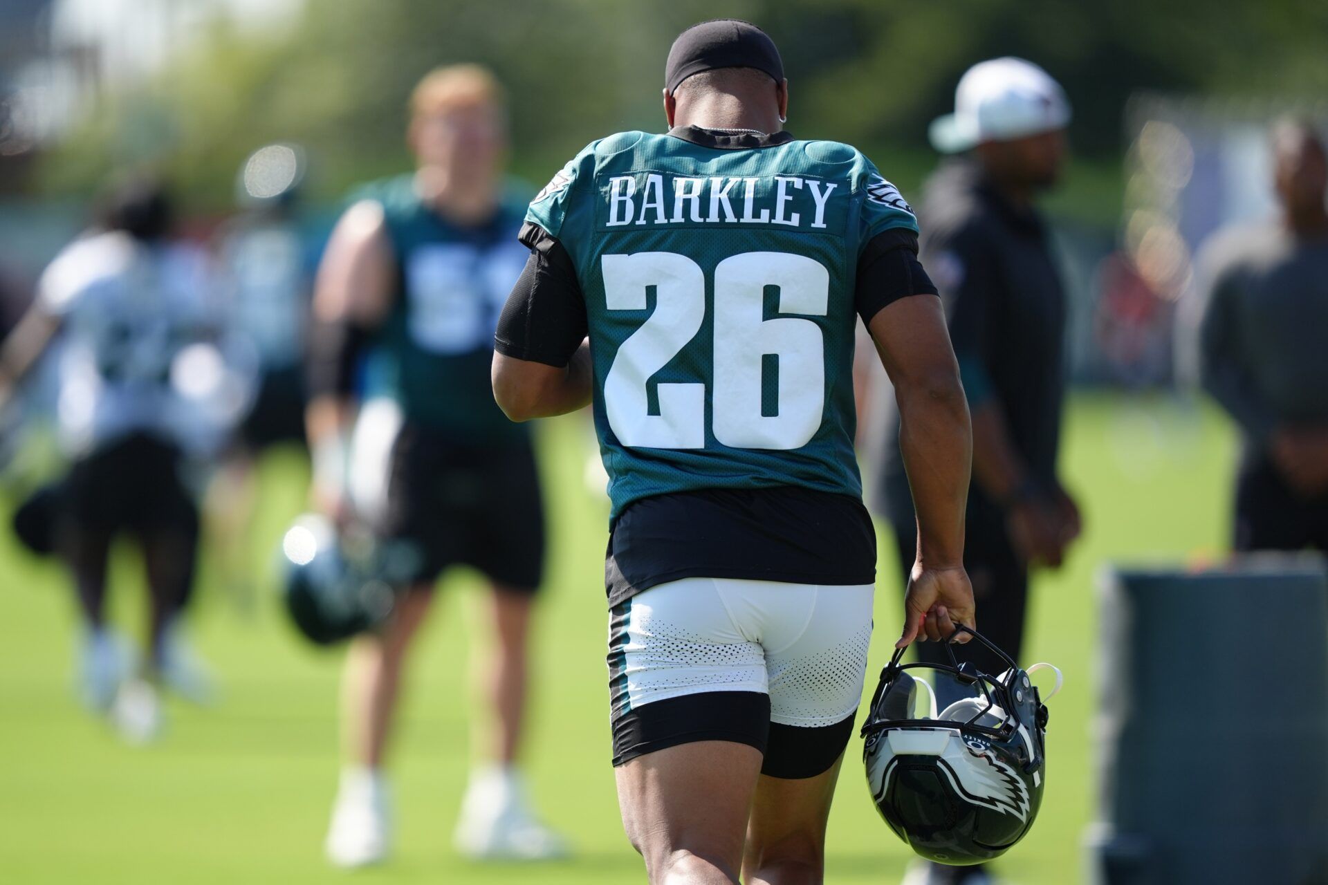 Philadelphia Eagles running back Saquon Barkley (26) enters the field during training camp at NovaCare Complex.