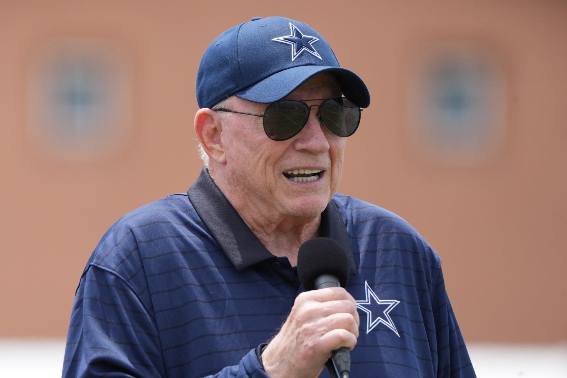 Dallas Cowboys owner Jerry Jones speaks at training camp opening ceremonies at the River Ridge Fields.