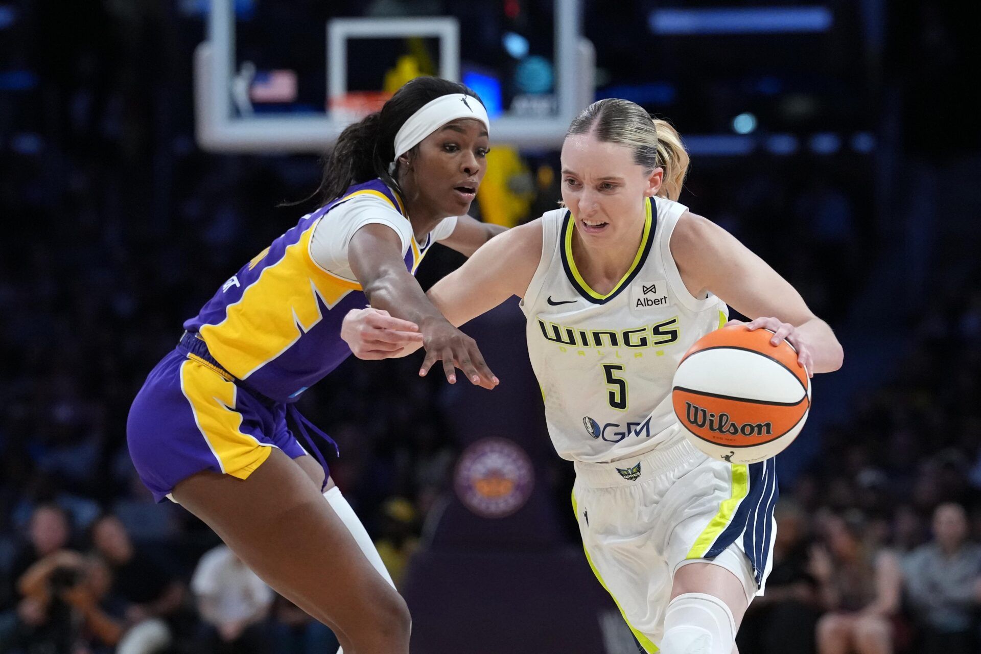 Dallas Wings guard Paige Bueckers (5) dribbles against LA Sparks forward Rickea Jackson (2) in the first half at Crypto.com Arena.