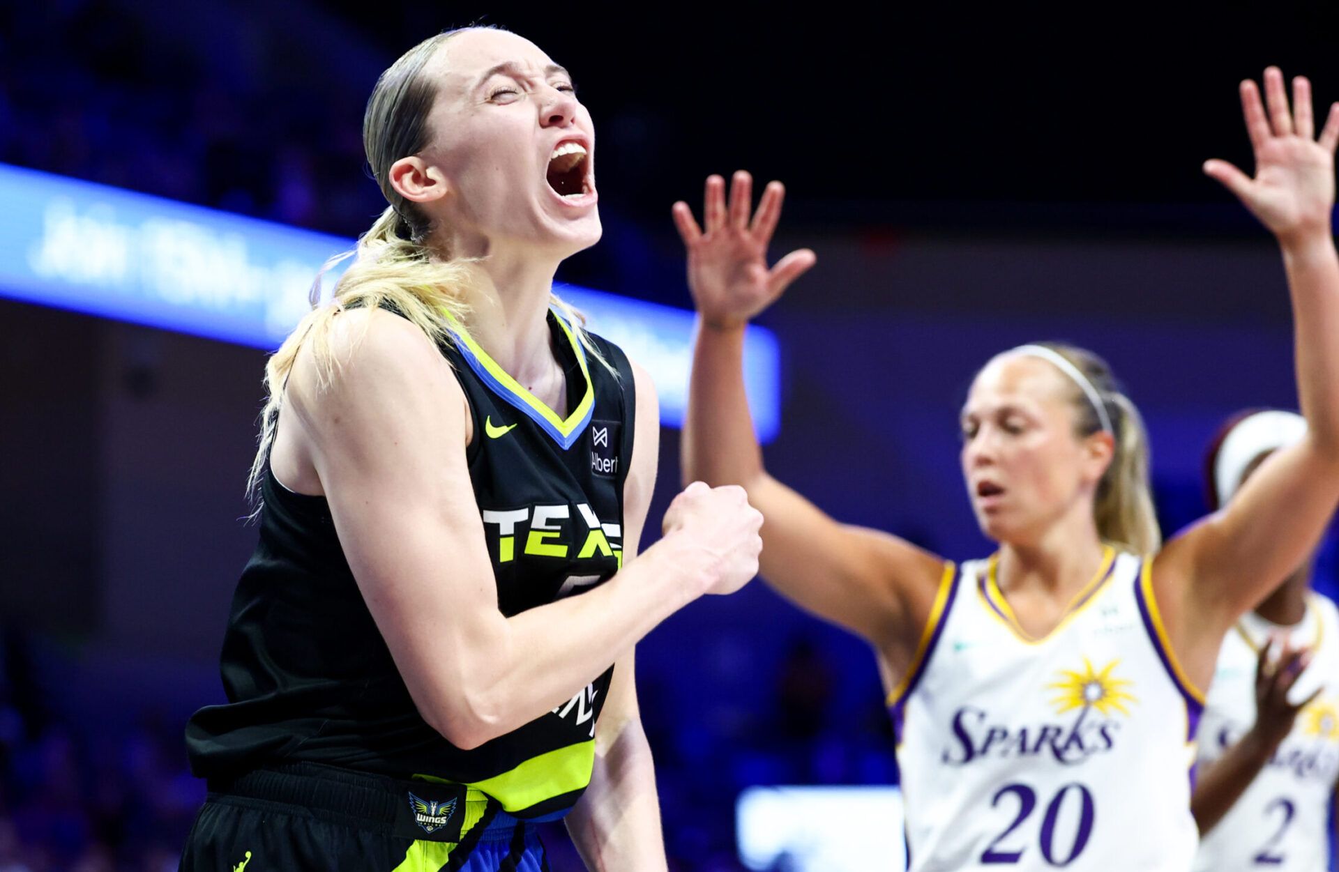 Dallas Wings guard Paige Bueckers (5) reacts in front of Los Angeles Sparks guard Julie Allemand (20) during the second half at College Park Center.