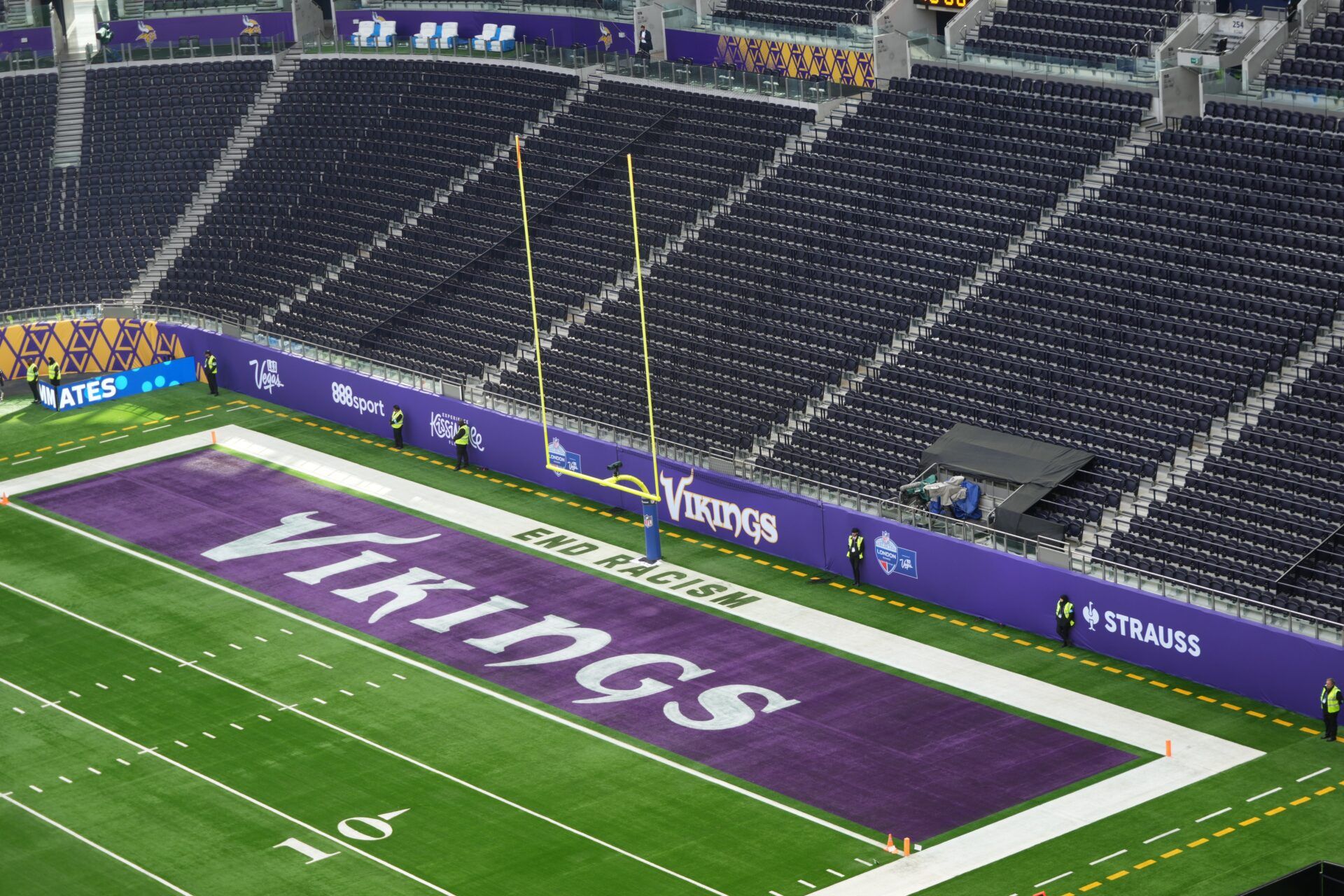 The Minnesota Vikings logo in the end zone at Tottenham Hotspur Stadium.