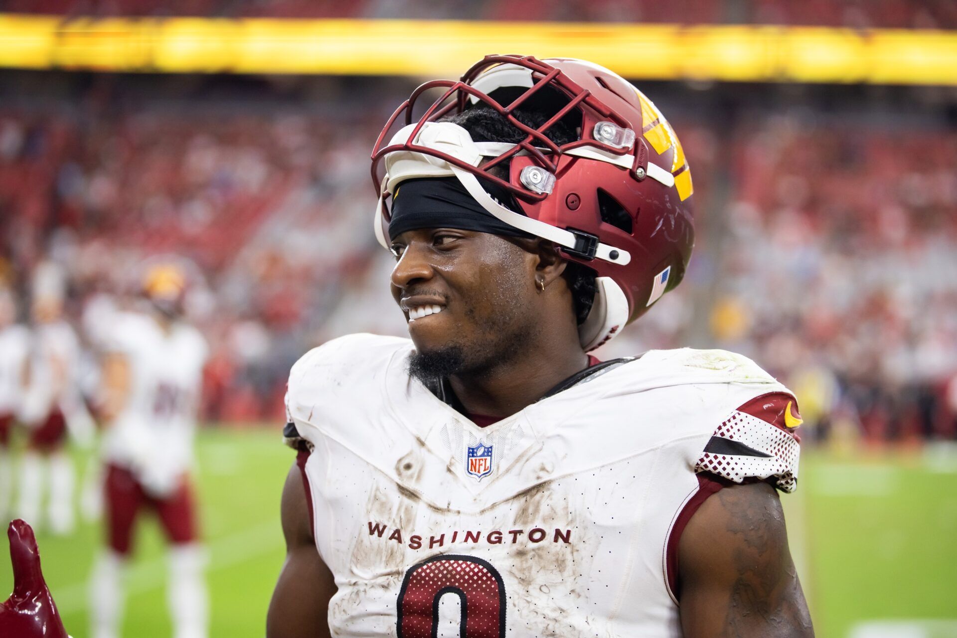 Washington Commanders running back Brian Robinson Jr. (8) against the Arizona Cardinals at State Farm Stadium.
