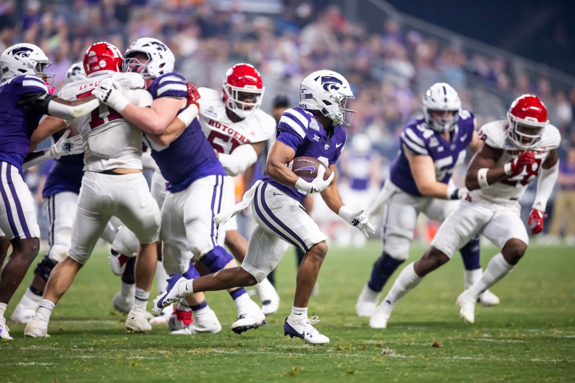 Kansas State Wildcats running back Dylan Edwards (3) against the Rutgers Scarlet Knights during the second half of the Rate Bowl at Chase Field.