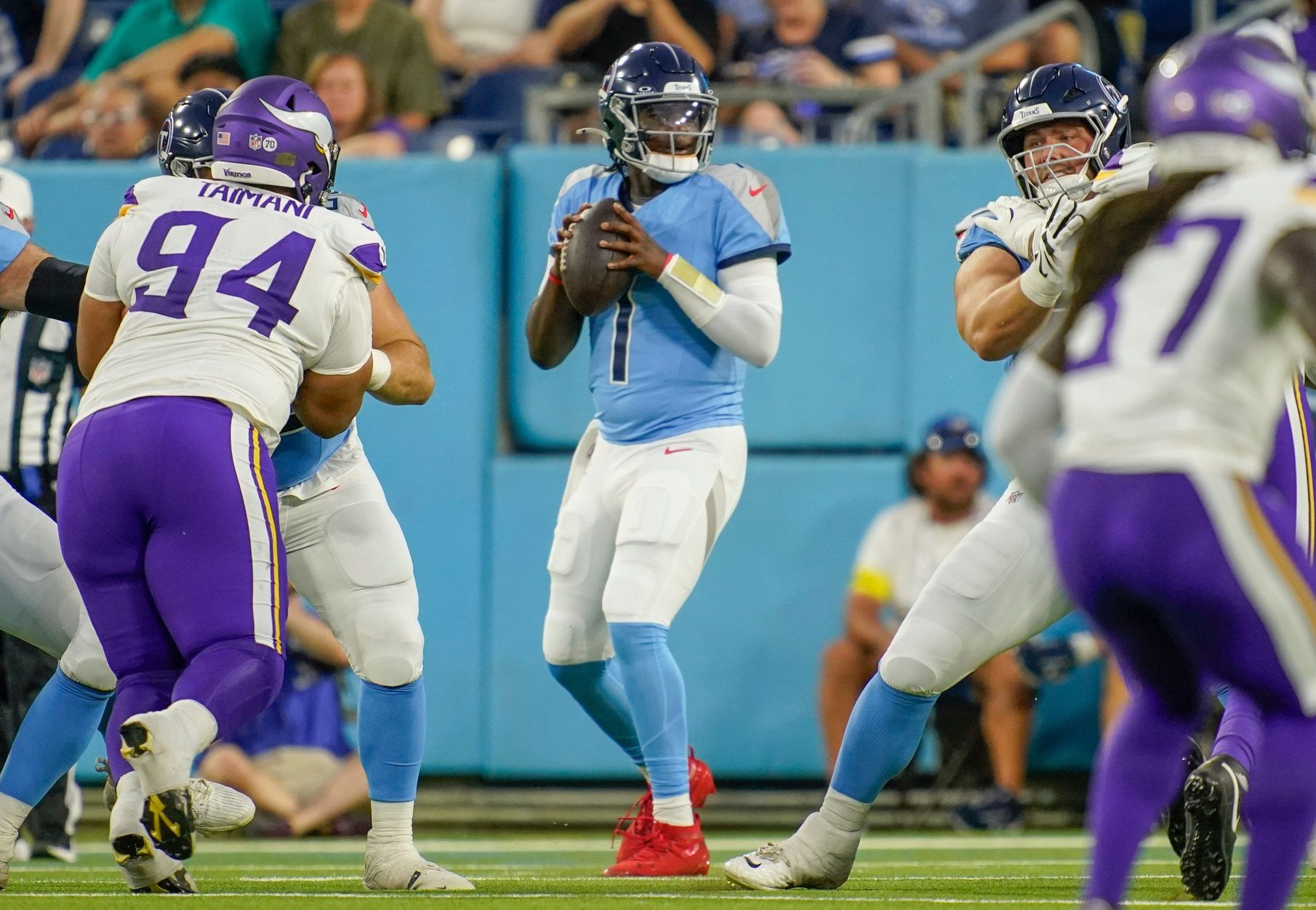 Tennessee Titans quarterback Cam Ward (1) looks for a receiver during the first quarter of an NFL pre-season game against the Minnesota Vikings at Nissan Stadium in Nashville, Tenn., Friday, Aug. 22, 2025.