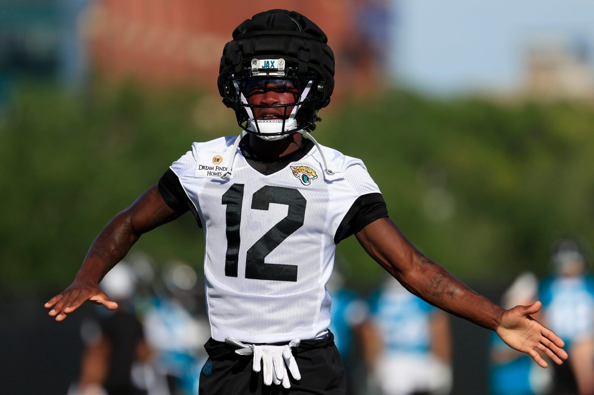 Jacksonville Jaguars wide receiver Travis Hunter (12) claps to music during an NFL training camp session at the Miller Electric Center, Monday, Aug. 11, 2025 in Jacksonville, Fla. [Corey Perrine/Florida Times-Union]