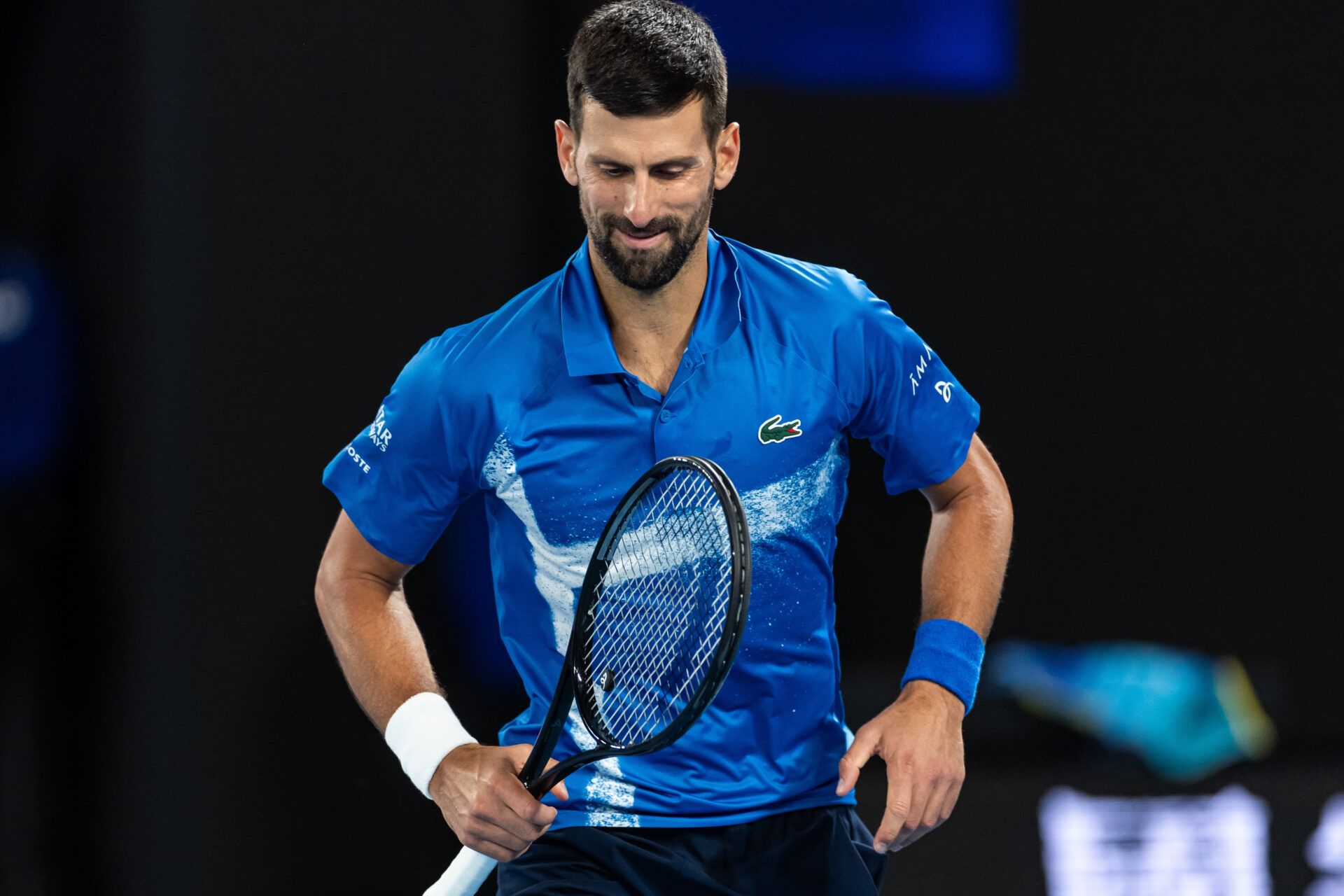 Novak Djokovic of Serbia gestures during his match against Carlos Alcaraz of Spain in the quarterfinals of the men's singles at the 2025 Australian Open at Melbourne Park.