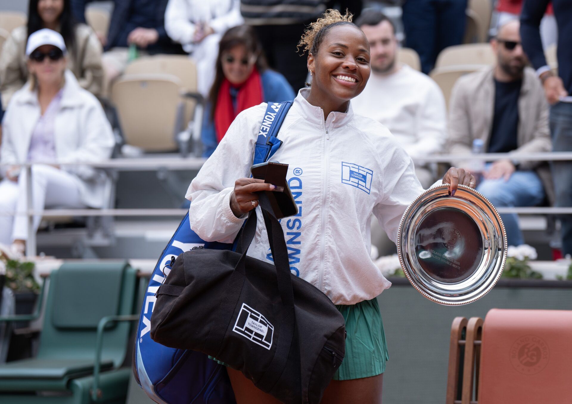 Taylor Townsend of the United States shows her finalist trophy after losing the mixed doubles final with Evan King of the United States against Sara Errani of Italy and Andrea Vavassori of Italy on day 12 at Roland Garros Stadium.