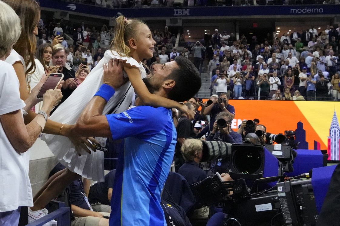 Novak Djokovic of Serbia celebrates with his daughter Tara after his match against Daniil Medvedev (not pictured) in the men's singles final on day fourteen of the 2023 U.S. Open tennis tournament at USTA Billie Jean King National Tennis Center.