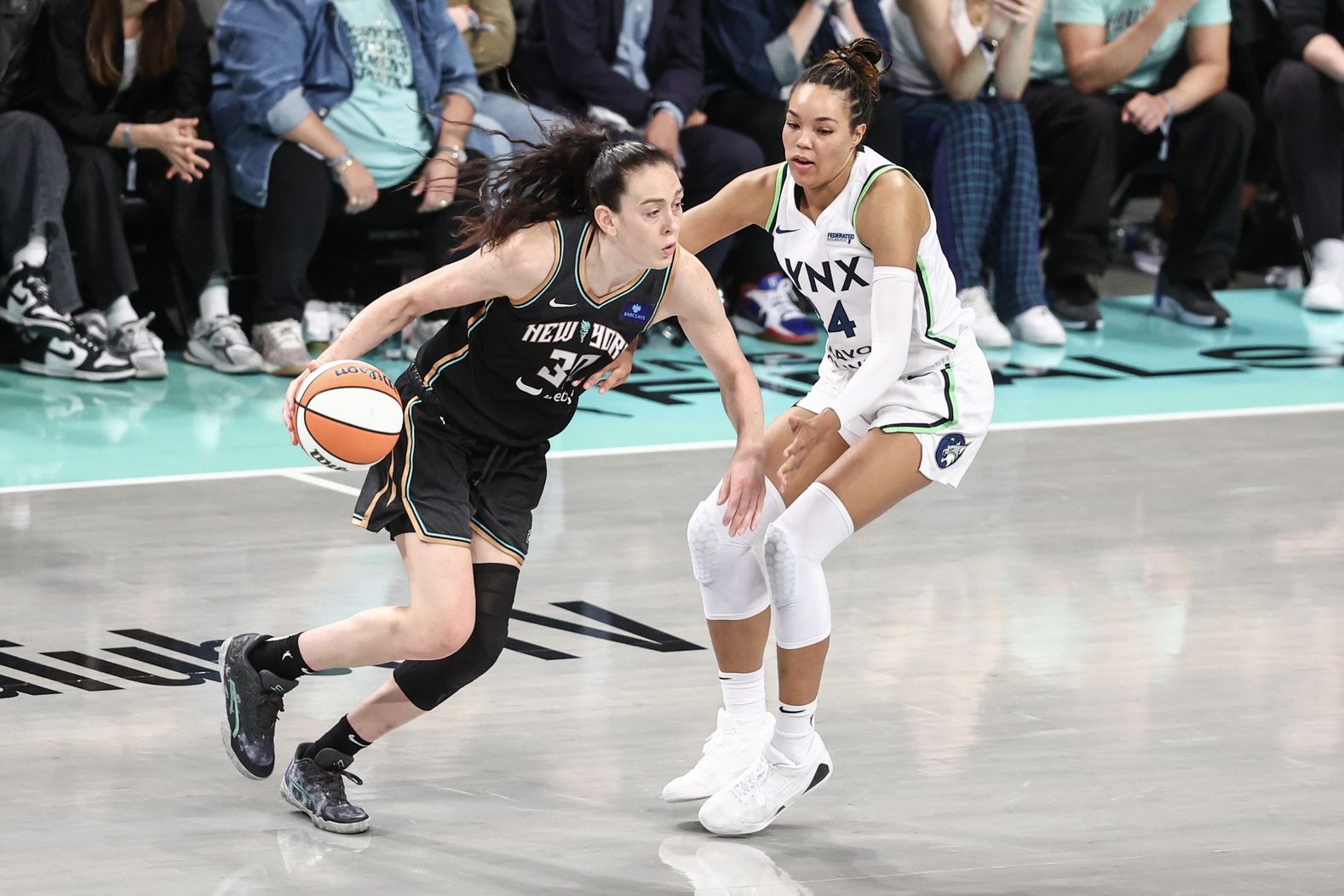 New York Liberty forward Breanna Stewart (30) looks to drive past Minnesota Lynx forward Napheesa Collier (24) in the fourth quarter during game two of the 2024 WNBA Finals at Barclays Center.
