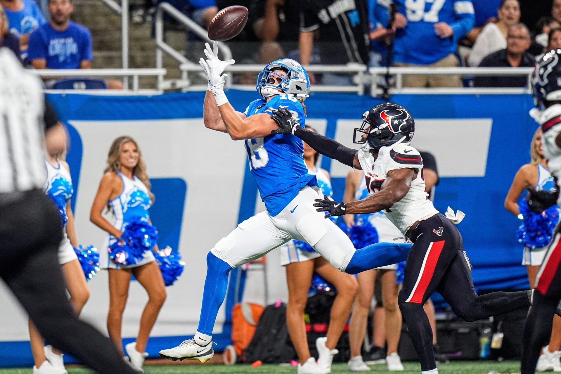Detroit Lions wide receiver Isaac TeSlaa (18) makes a catch for a touchdown against Houston Texans cornerback D'Angelo Ross (37) during the first half at Ford Field in Detroit on Saturday, August 23, 2025.