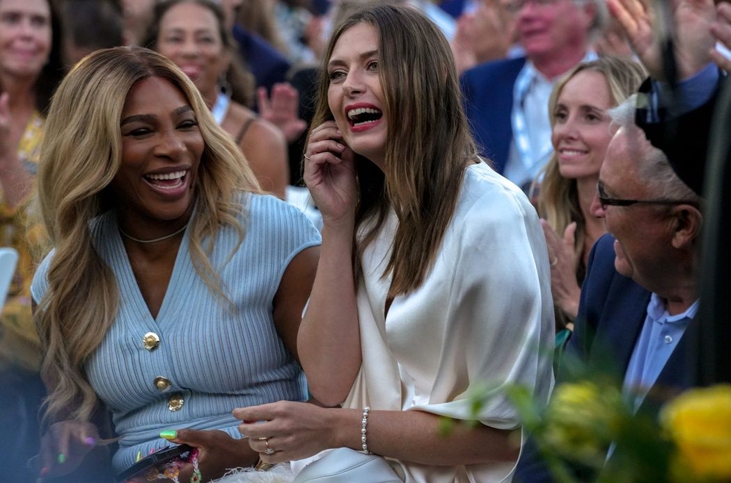 Tennis legend Serena Williams, left, makes a surprise appearance to induct Maria Sharapova into the International Tennis Hall of Fame on Aug. 23.