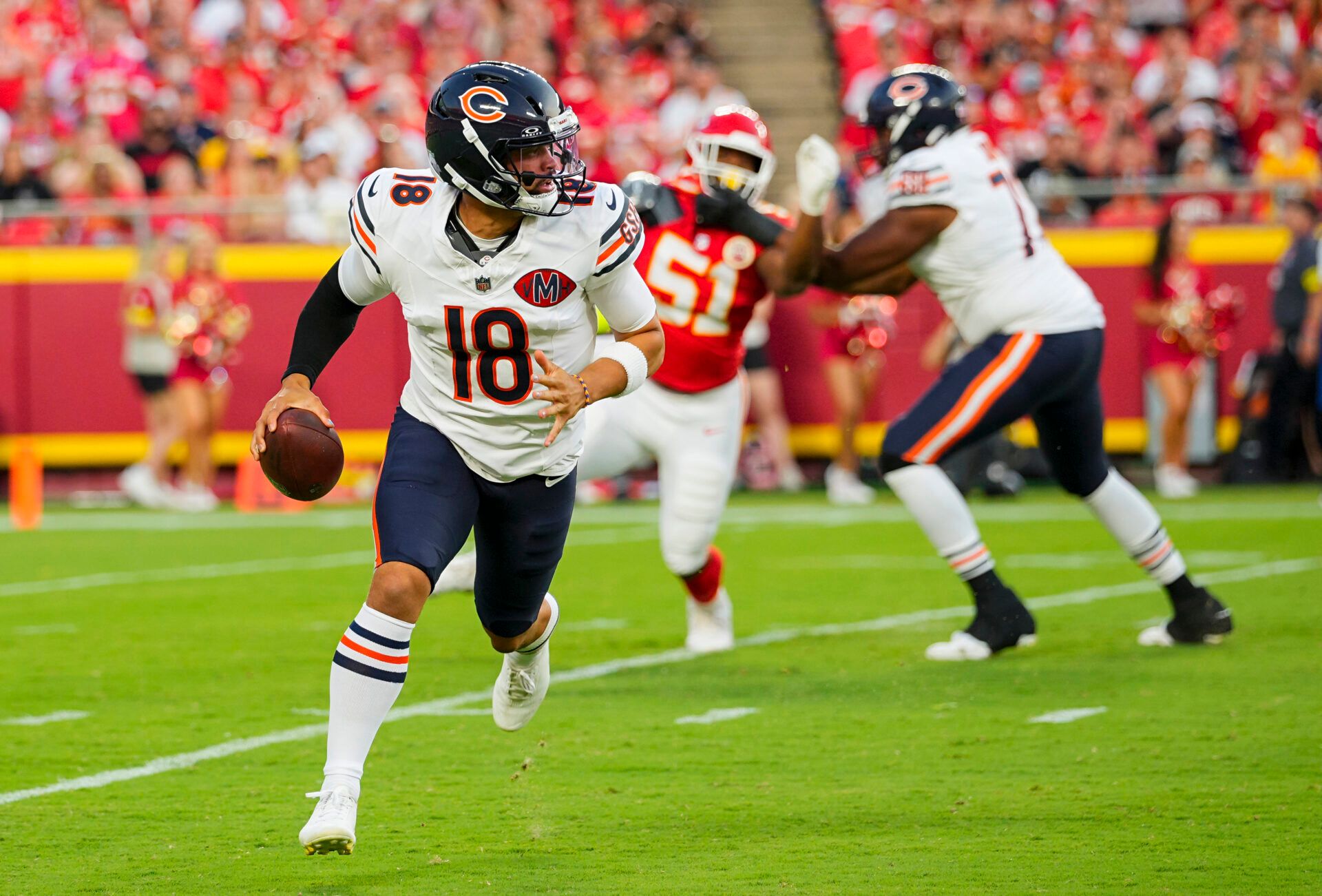 Chicago Bears quarterback Caleb Williams (18) scrambles during the first half against the Kansas City Chiefs at GEHA Field at Arrowhead Stadium.
