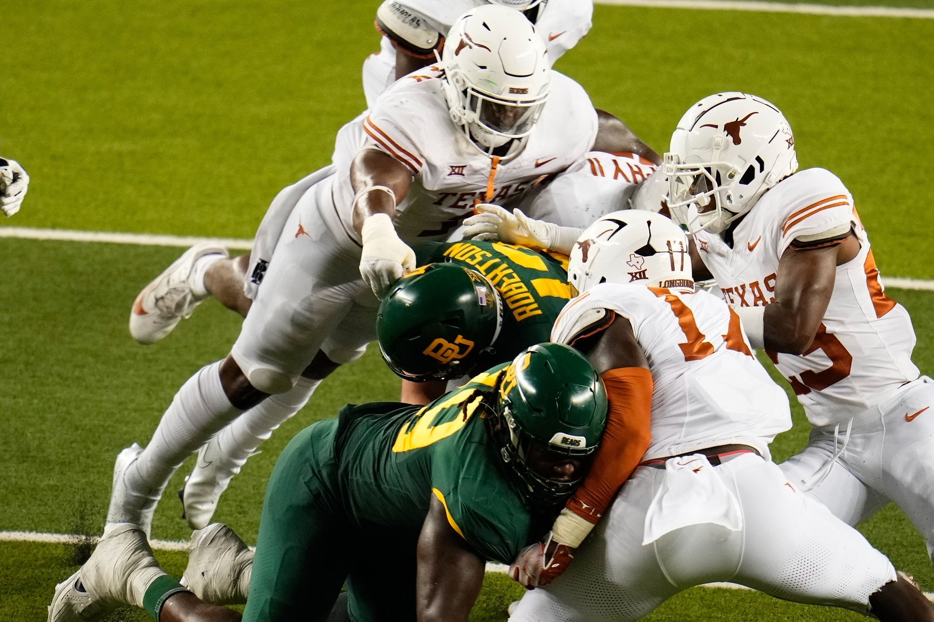 Baylor Bears quarterback Sawyer Robertson (13) is sacked by Texas Longhorns defensive lineman Byron Murphy II (90) during the second half at McLane Stadium.