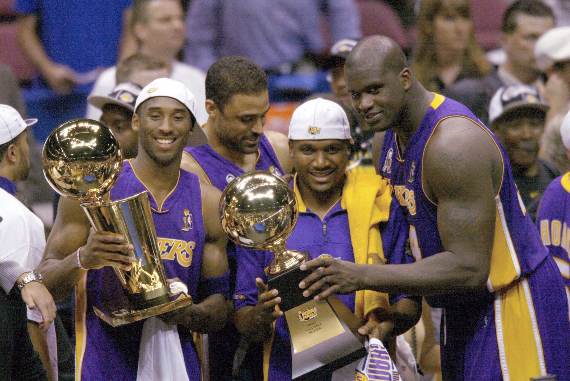 (left to right) Los Angeles Lakers Kobe Bryant,  Lindsay Hunter and Shaquille O'Neal hold championship trophies after winning Game 4 of the NBA Finals at The Meadowlands.