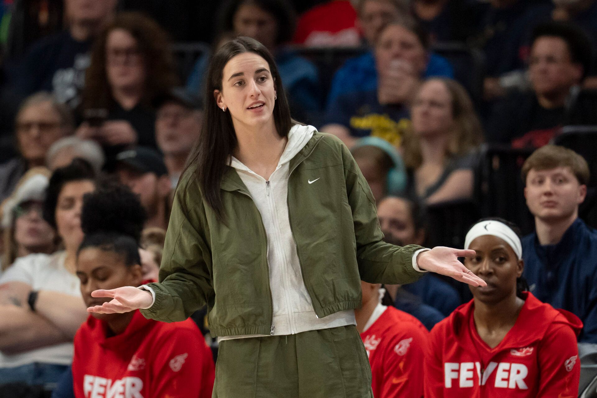 Indiana Fever guard Caitlin Clark (22) looks on from the bench against the Minnesota Lynx in the second half at Target Center.