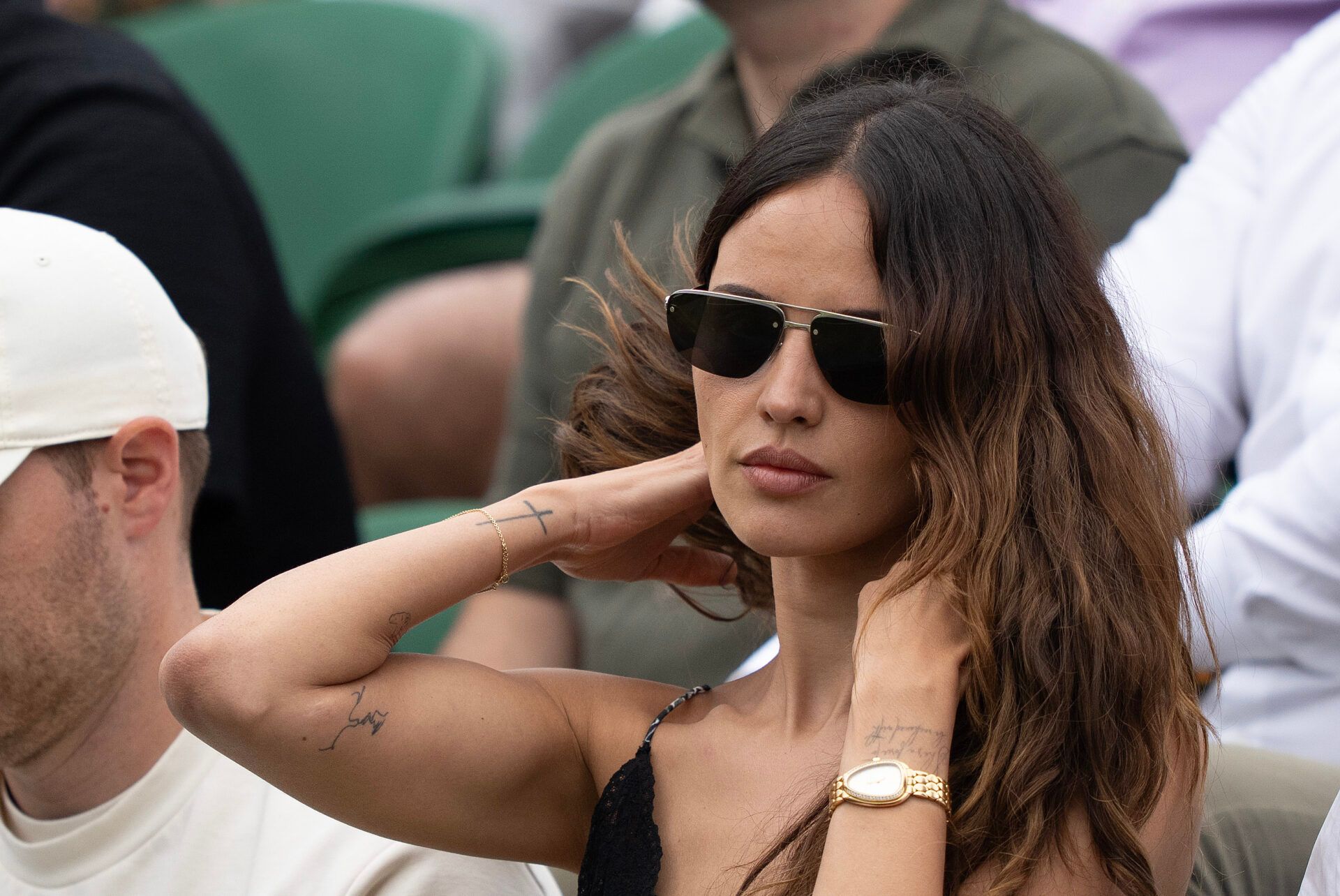 Eiza Gonzalez watches the match of boyfriend, Grigor Diitrov of Bulgaria against Sebastian Ofner of Austria on day six at the All England Lawn Tennis and Croquet Club.