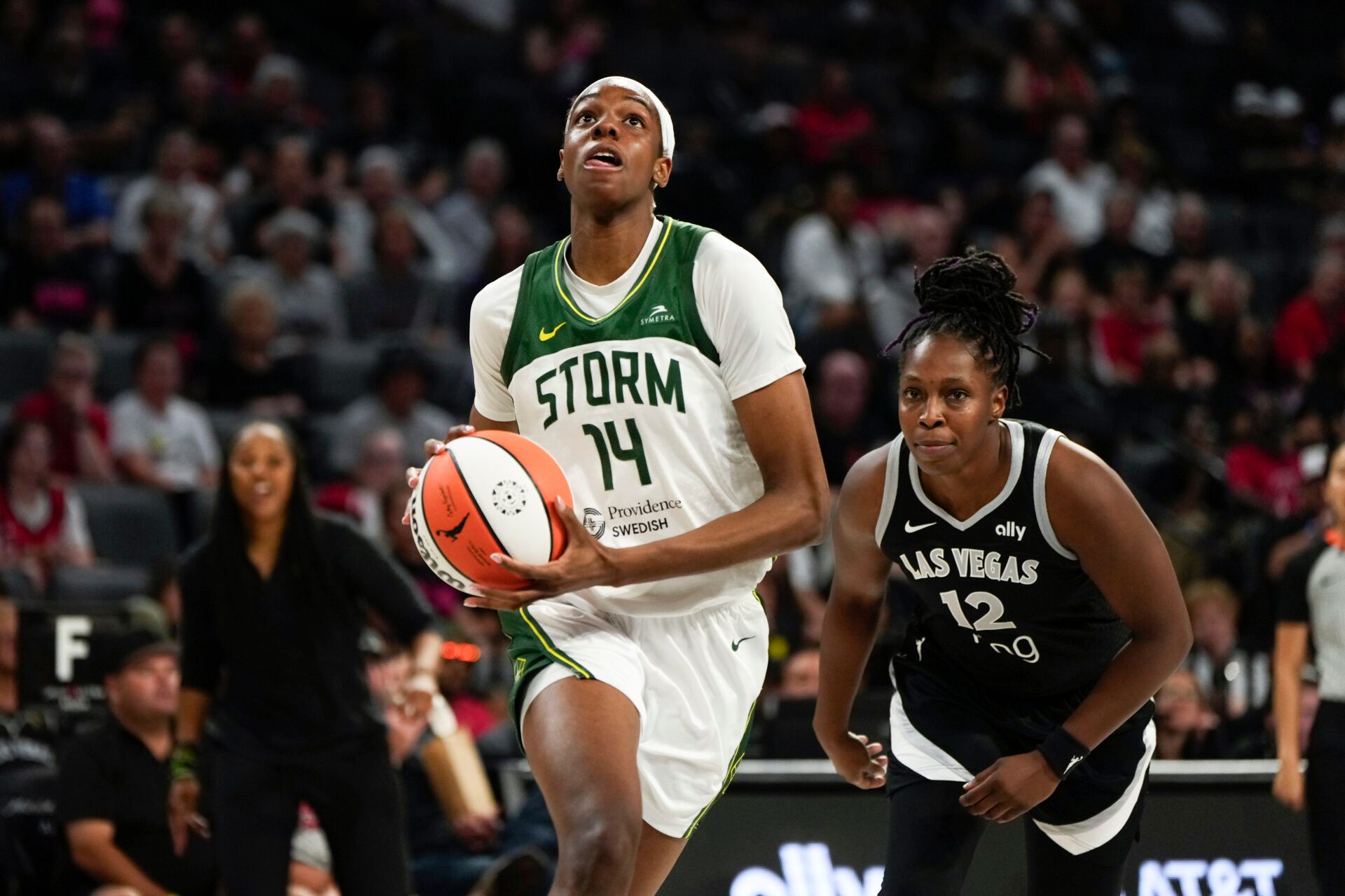 Seattle Storm center Dominique Malonga (14) attempts to score a layup against Las Vegas Aces guard Chelsea Gray (12) during the second half of a WNBA basketball game at Michelob Ultra Arena.