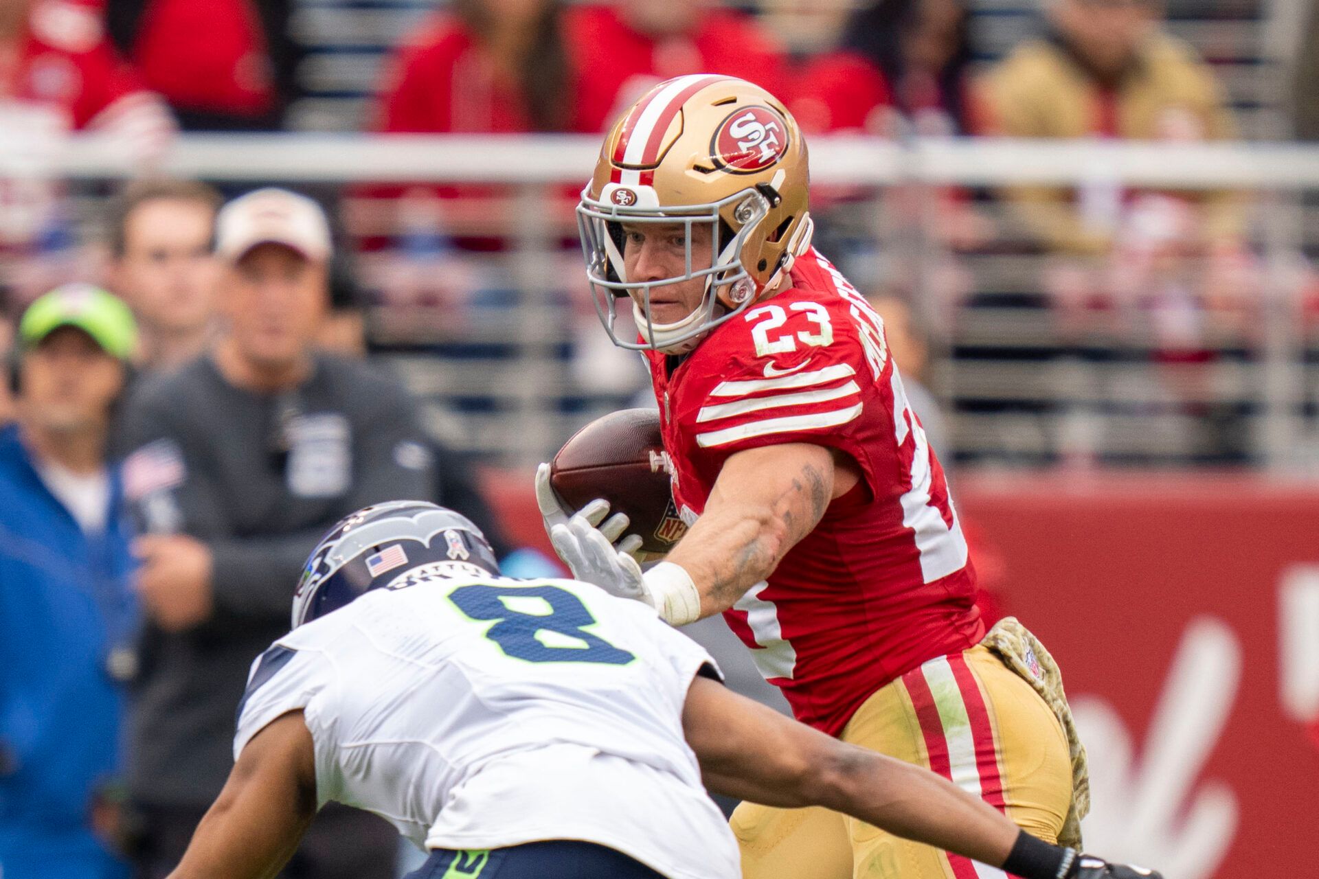 San Francisco 49ers running back Christian McCaffrey (23) runs against Seattle Seahawks cornerback Coby Bryant (8) during the second quarter at Levi's Stadium.