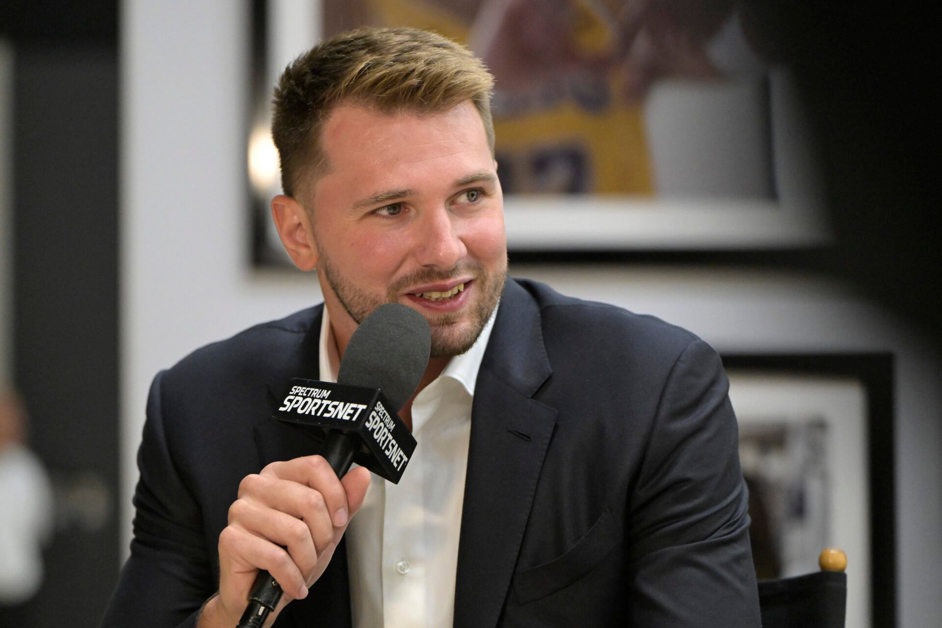 Los Angeles Lakers Luka Doncic (77) is interviewed Spectrum SportsNet following a press conference announcing the signing of his contract extension at UCLA Health Training Center.