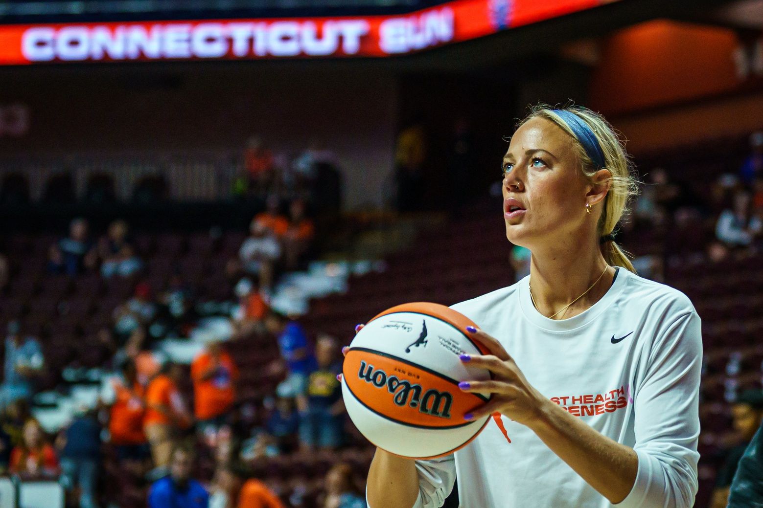Indiana Fever guard Sophie Cunningham (8) warms up before the start of the game against the Connecticut Sun at Mohegan Sun Arena.