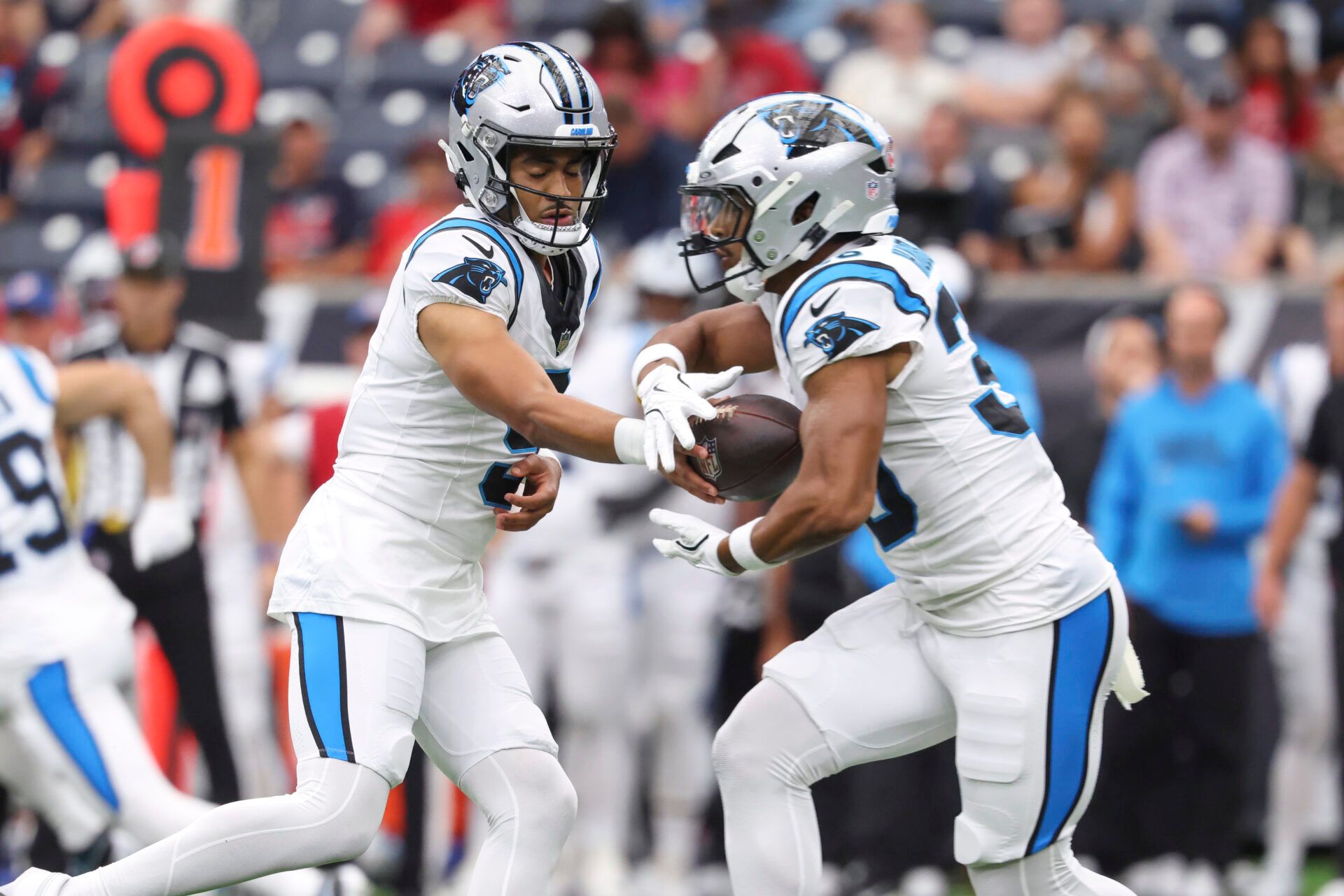 Carolina Panthers quarterback Bryce Young (9) hands off to running back Chuba Hubbard (30) during the first quarter against the Houston Texans at NRG Stadium.