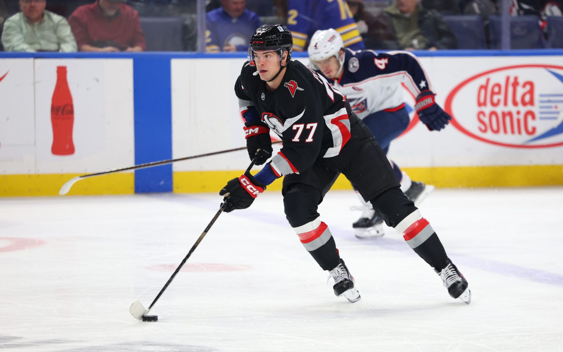 Buffalo Sabres right wing JJ Peterka (77) skates up ice with the puck during the first period against the Columbus Blue Jackets at KeyBank Center.