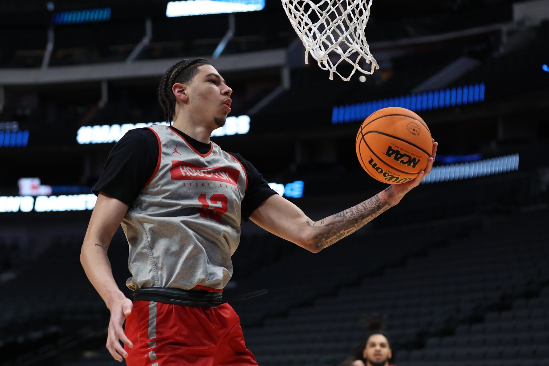 Houston Cougars center Jacob McFarland (12) goes through drills during practice at American Airline Center.