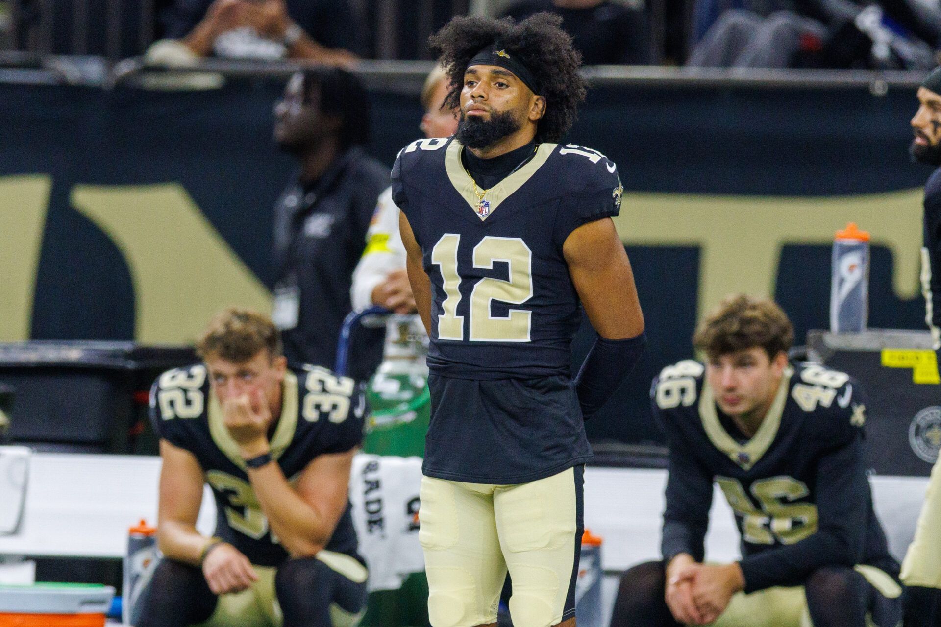 New Orleans Saints wide receiver Chris Olave (12) and punter Kai Kroeger (32) and punter James Burnip (46) looks on against the Jacksonville Jaguars during the first half at Caesars Superdome.