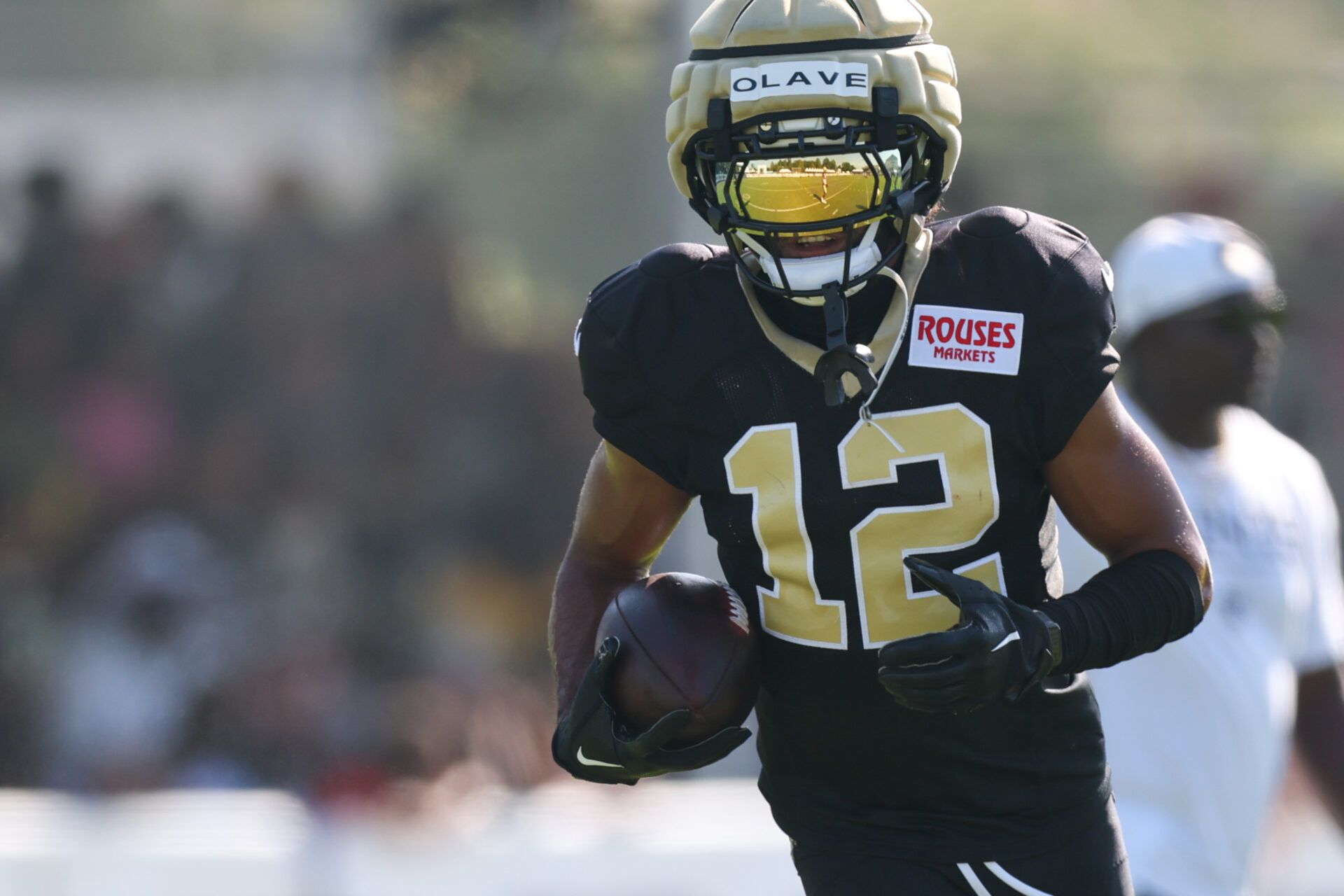 New Orleans Saints wide receiver Chris Olave (12) runs routes during training camp at Ochsner Sports Performance Center.