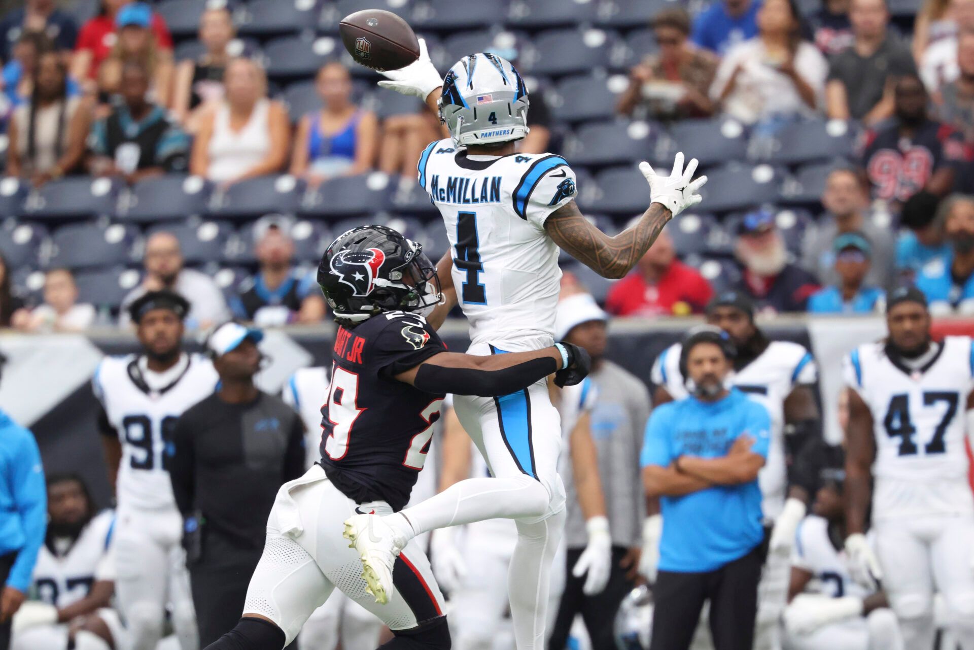 Carolina Panthers wide receiver Tetairoa McMillan (4) attempts to make a reception as Houston Texans safety M.J. Stewart (29) defends during the first quarter at NRG Stadium.