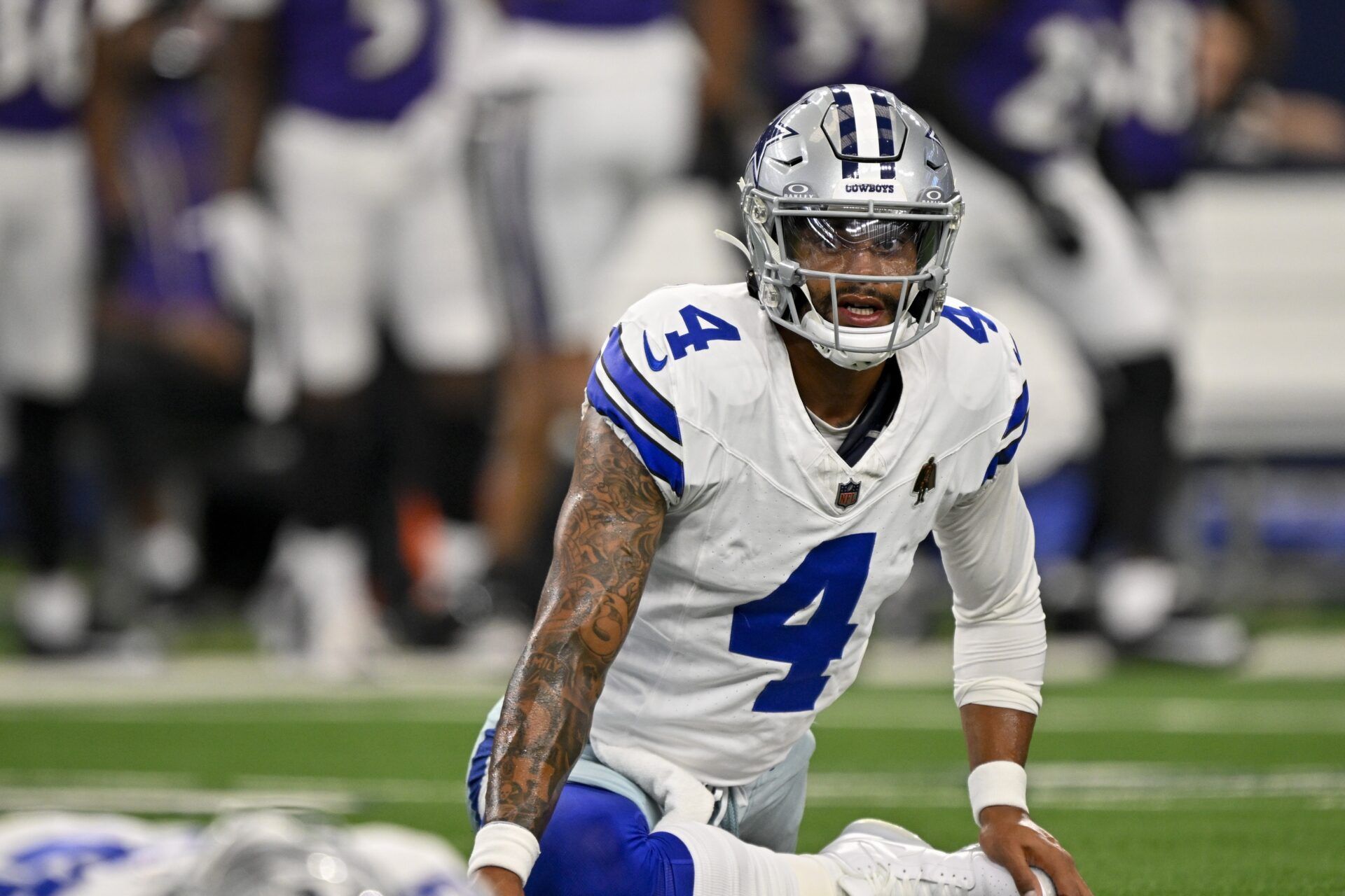Dallas Cowboys quarterback Dak Prescott (4) warms up before the game against the Baltimore Ravens at AT&T Stadium.