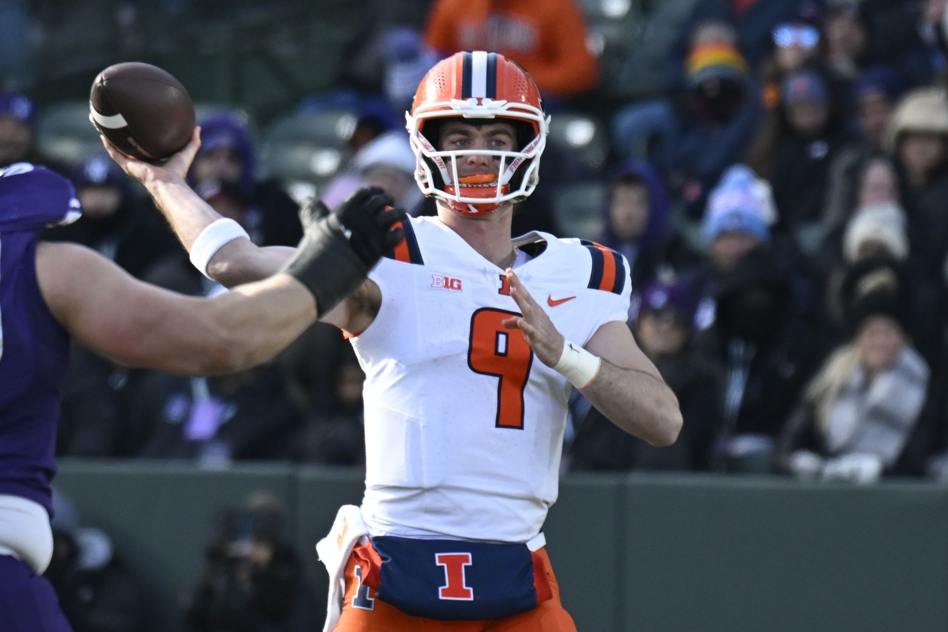 Illinois Fighting Illini quarterback Luke Altmyer (9) passes the ball against Northwestern Wildcats  during the first half at Wrigley Field.