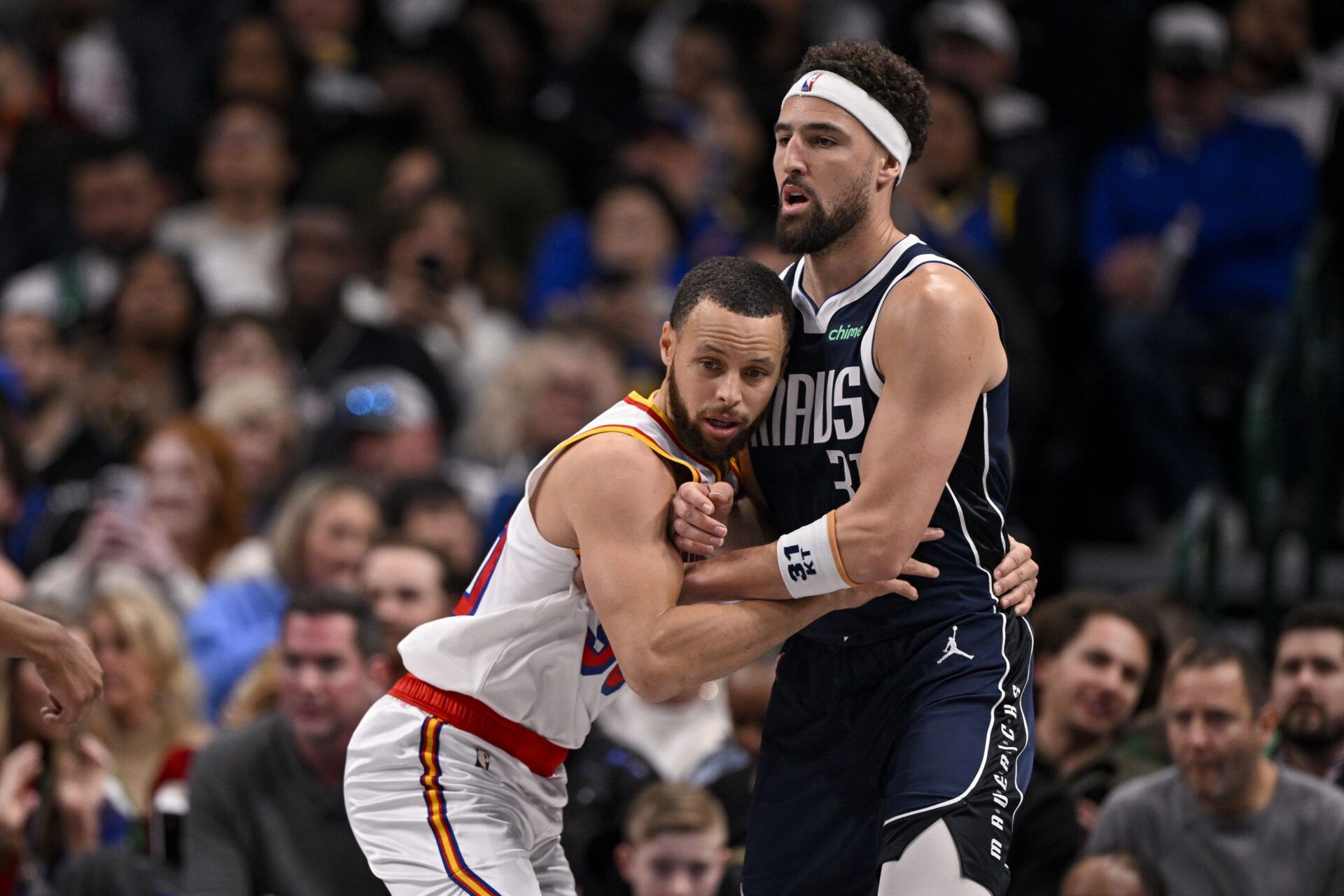 Golden State Warriors guard Stephen Curry (30) and Dallas Mavericks guard Klay Thompson (31) in action during the game between the Dallas Mavericks and the Golden State Warriors at the American Airlines Center.