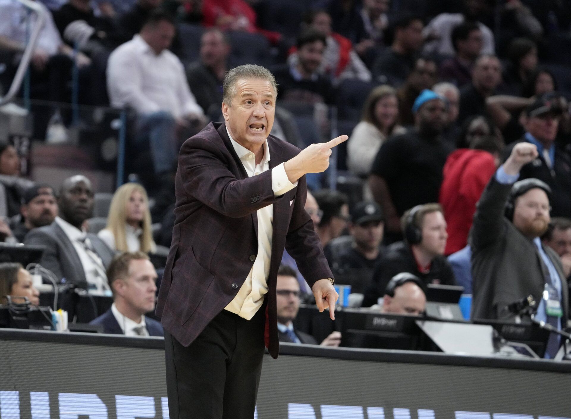 Arkansas Razorbacks head coach John Calipari directs play downcourt during the first half against the Texas Tech Red Raiders during a West Regional semifinal of the 2025 NCAA tournament at Chase Center.