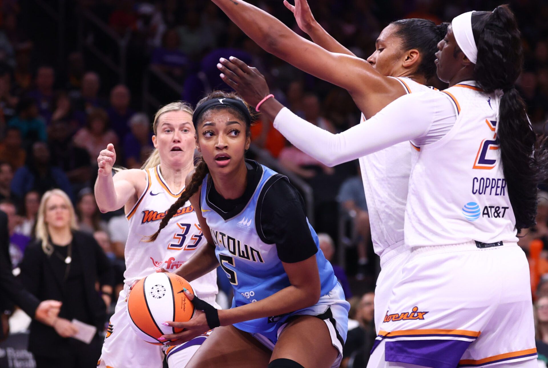 Chicago Sky forward Angel Reese (5) against Phoenix Mercury forward Alyssa Thomas (25) and Kahleah Copper (2) in the first half at Phx Arena.
