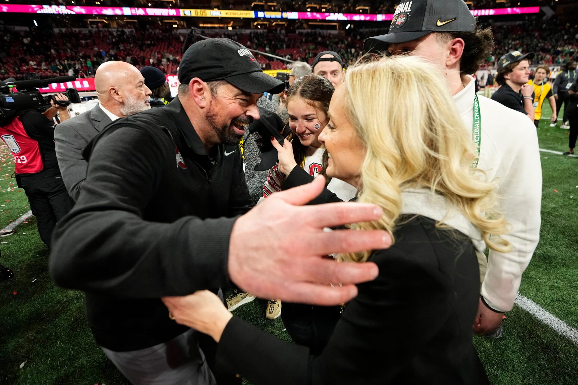 Ohio State Buckeyes head coach Ryan Day hugs his wife, Nina Day, and kids following the 34-23 win over the Notre Dame Fighting Irish to win the College Football Playoff National Championship at Mercedes-Benz Stadium in Atlanta on Jan. 21, 2025.