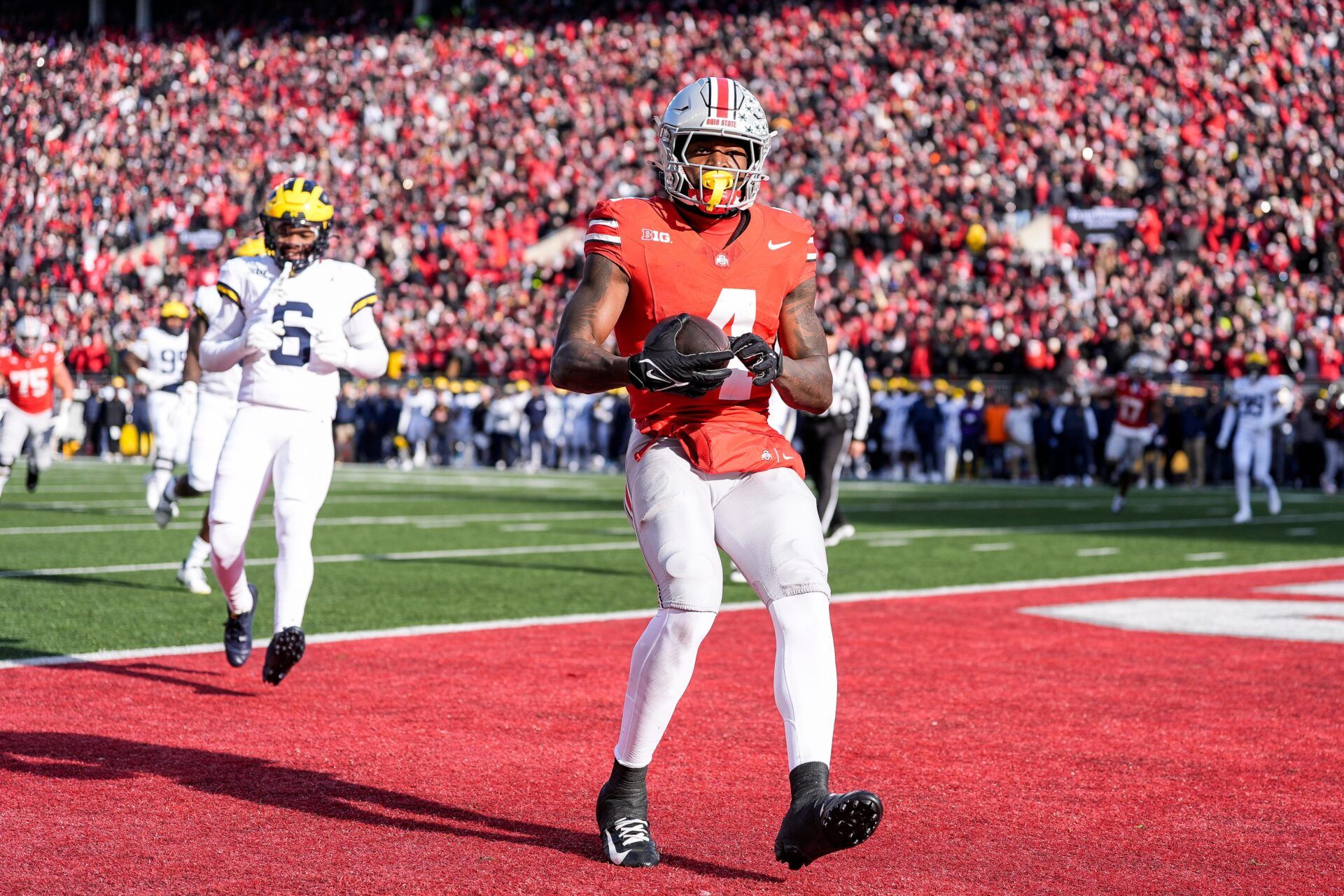 Ohio State wide receiver Jeremiah Smith makes a catch for a touchdown against Michigan during the first half at Ohio Stadium in Columbus, Ohio on Saturday, Nov. 30, 2024.
