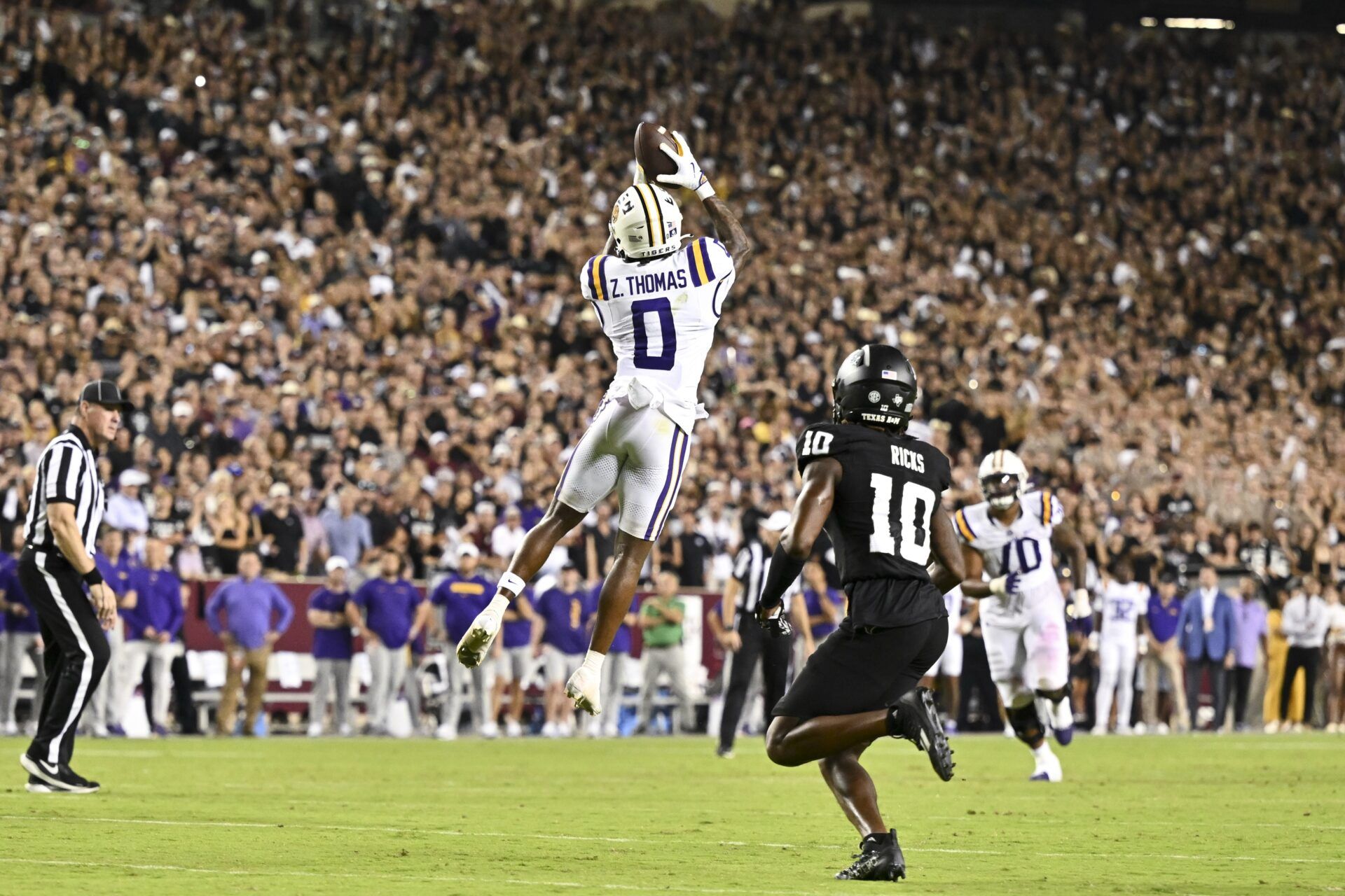 LSU Tigers wide receiver Zavion Thomas (0) leaps to catch a pass against the Texas A&M Aggies during the second half. The Aggies defeated the Tigers 38-23; at Kyle Field.