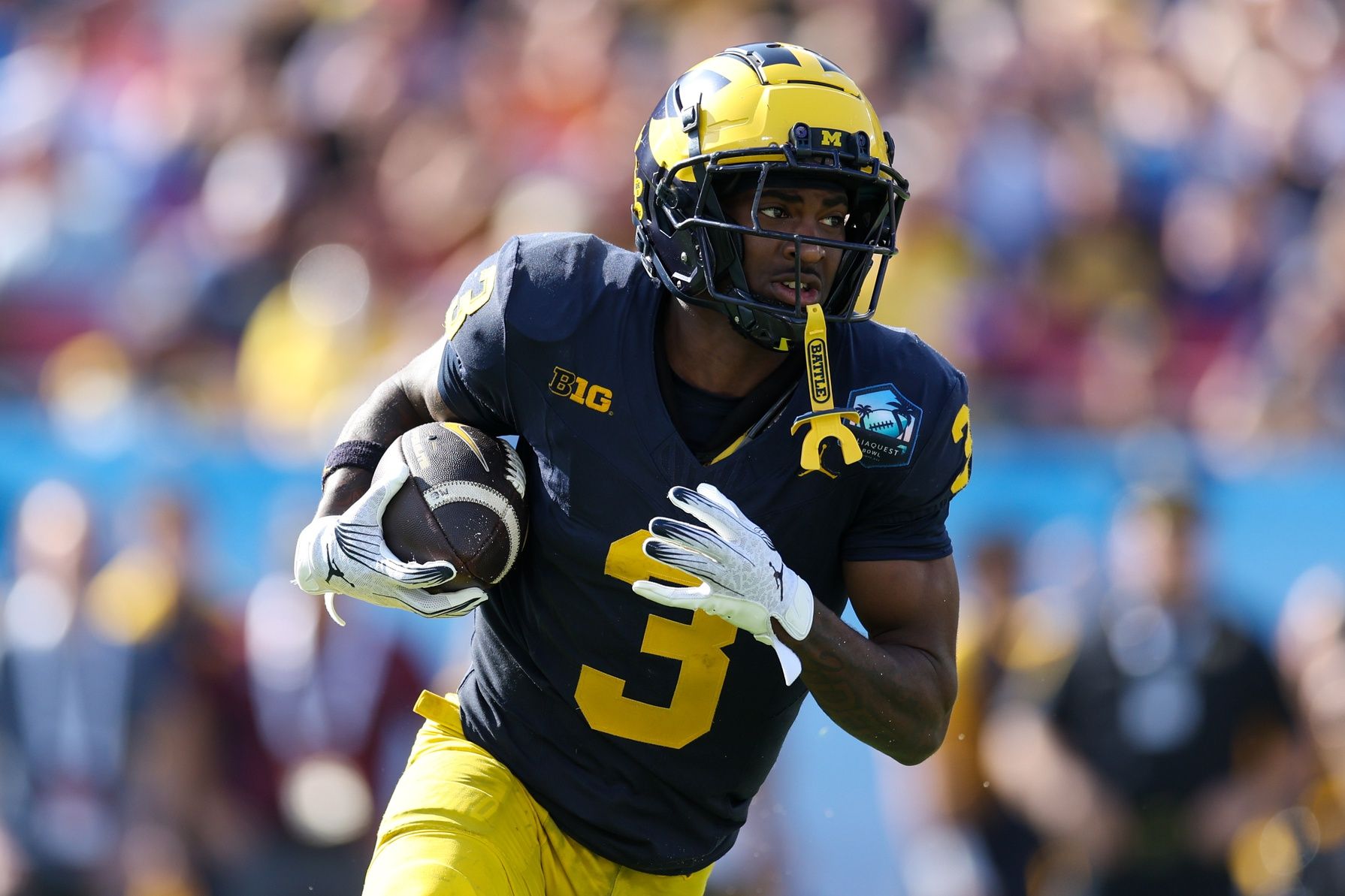 Michigan Wolverines wide receiver Fredrick Moore (3) runs with the ball against the Alabama Crimson Tide  in the third quarter  during the ReliaQuest Bowl at Raymond James Stadium.