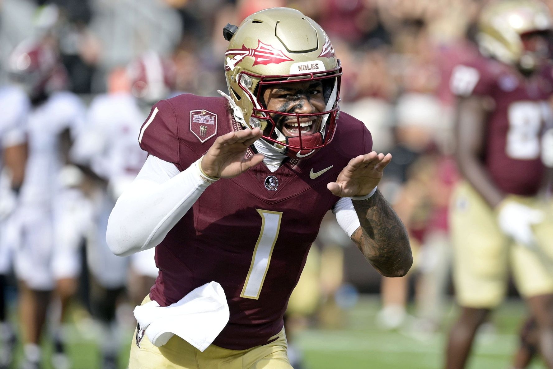 Florida State Seminoles quarterback Tommy Castellanos (1) celebrates after a touchdown against the Alabama Crimson Tide during the second half at Doak S. Campbell Stadium.