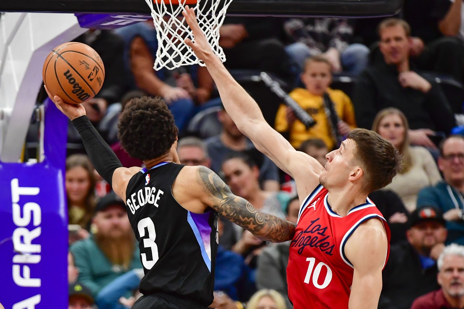 Utah Jazz guard Keyonte George (3) shoots against LA Clippers guard Bogdan Bogdanović (10) during the second half at the Delta Center.