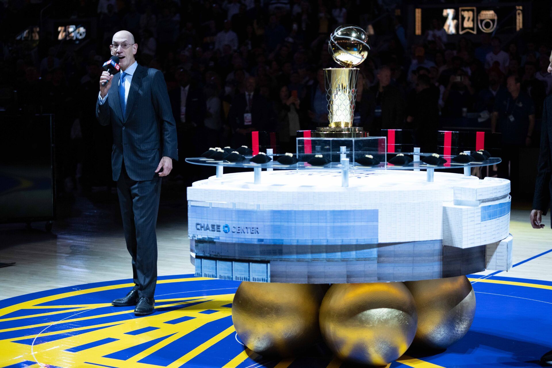 NBA commissioner Adam Silver speaks next to the Larry O'Brien Championship Trophy and championship rings before the game between the Golden State Warriors and the Los Angeles Lakers at Chase Center.